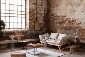 armchair and beige sofa in industrial living room interior with | Stan Bond Adelaide